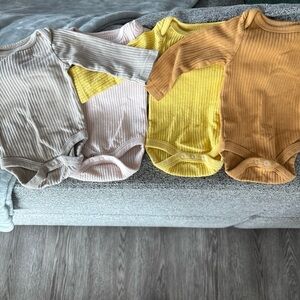 Cloud Island Ribbed Bodysuits in Gray, Pink, Yellow, and Tan